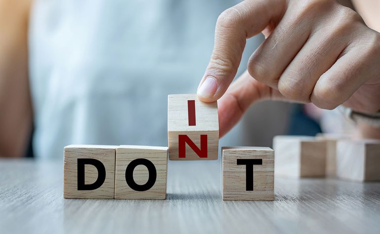 DOS & DONTS - Lady holding letter block that helps spell DOIT and DONT